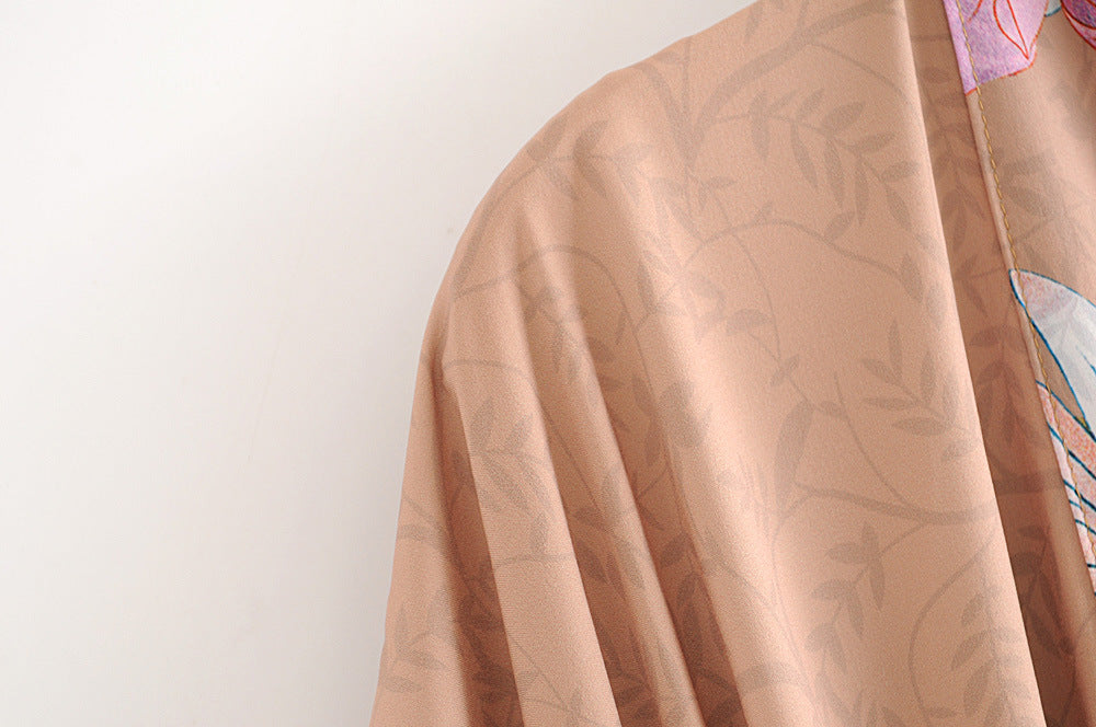 Brown kimono robe sleeve with colorful floral print detail