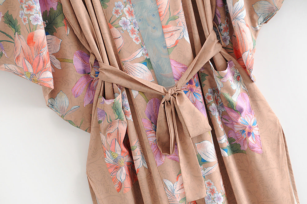 Matching waist belt detail on women's peacock floral kimono robe