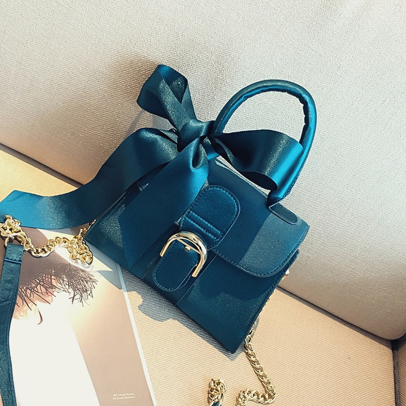 Women's velvet bow top-handle chain bag in black, blue, brown or pink