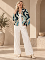 Women’s Retro Wave Fleece Jacket teal and beige close-up