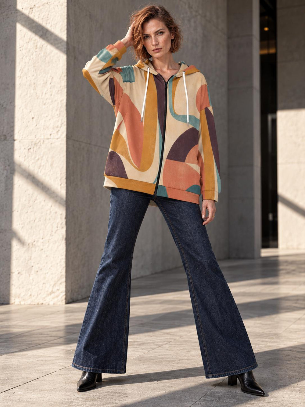 Retro abstract earth-tone longline zip hoodie on model, front editorial view